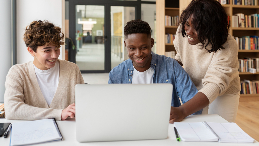 three people studying